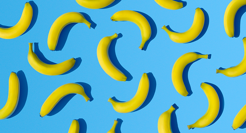 blue background with bananas