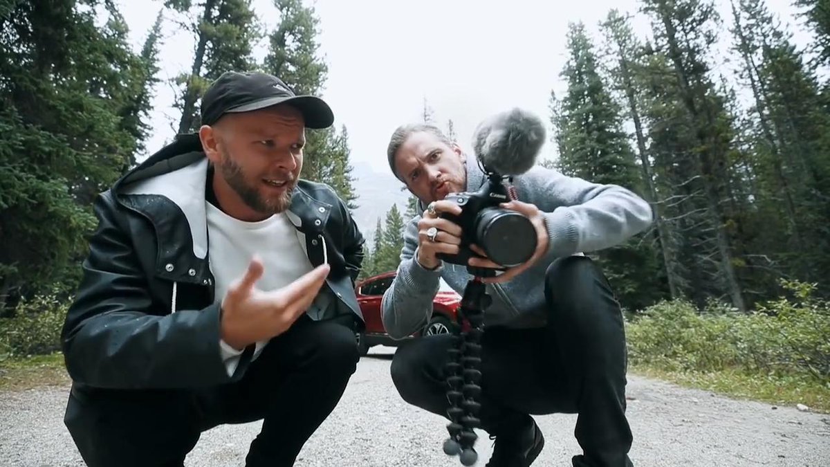 two men with a camera