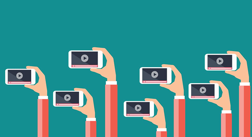 hands holding phone with green background