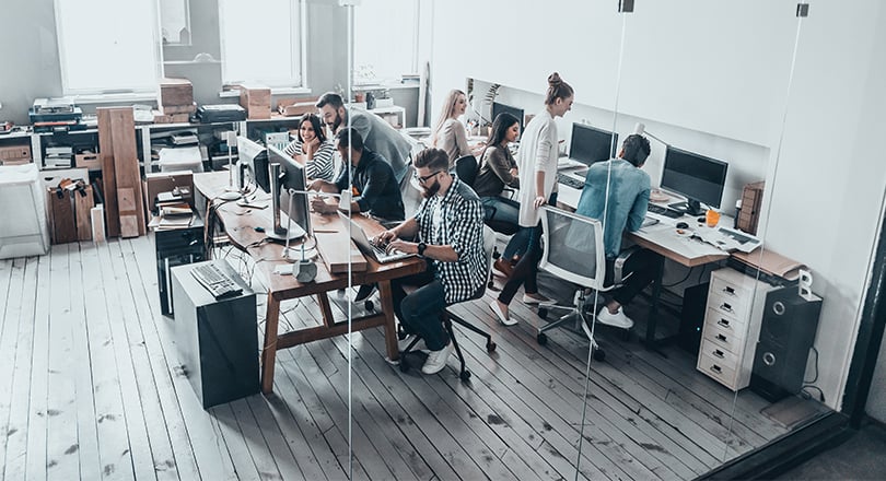 team of people working at their computer
