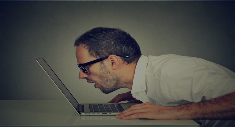 man looking at laptop