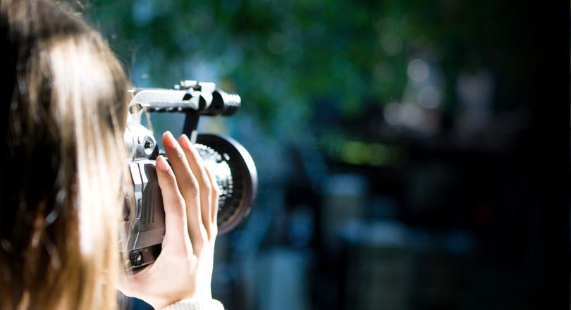 lady behind video camera
