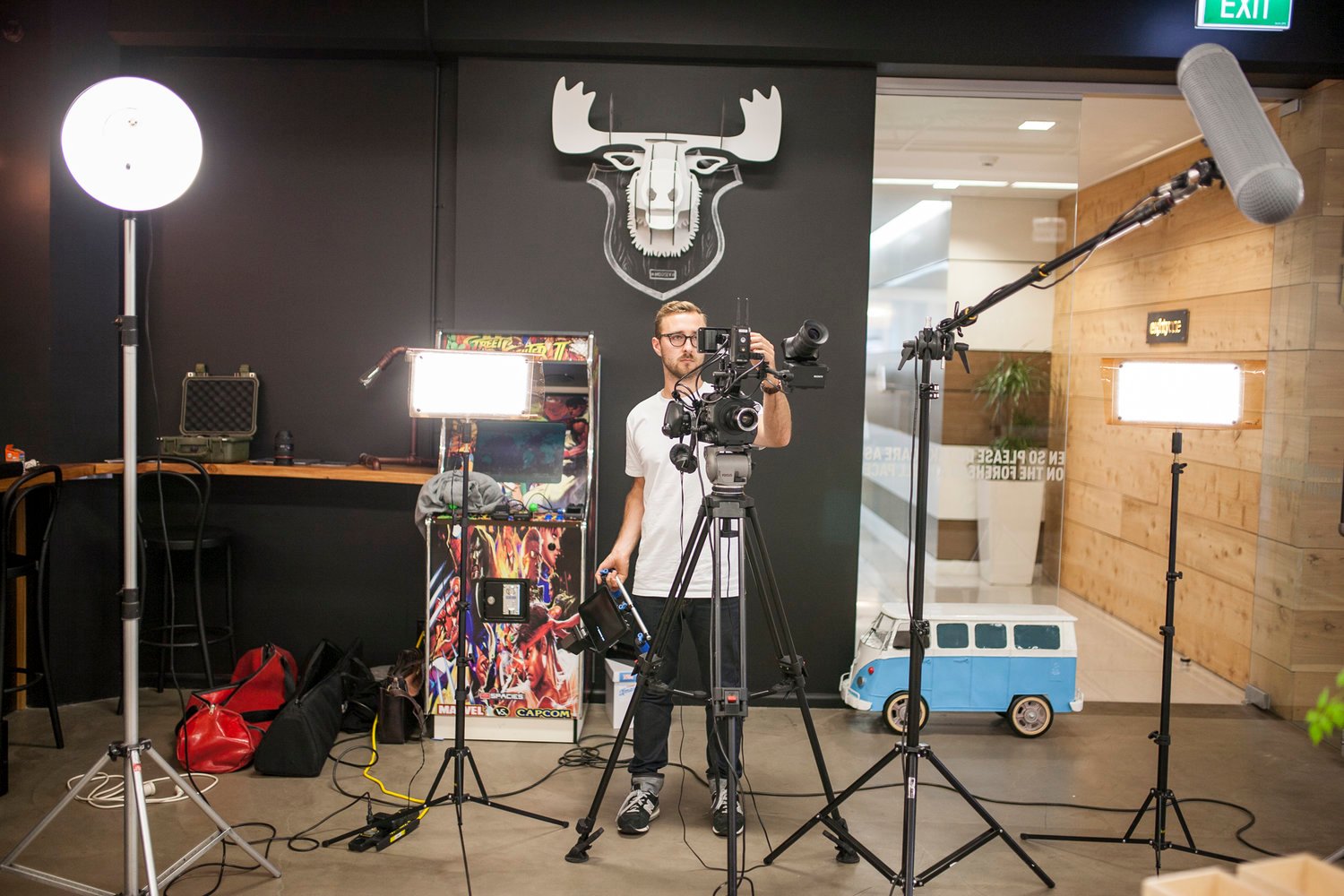man behind lights and camera