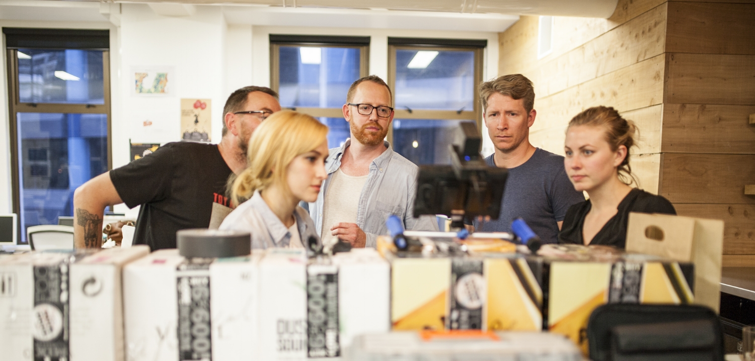 People looking at video equipment