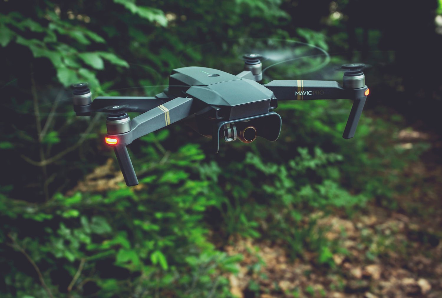 picture of a green drone over bush