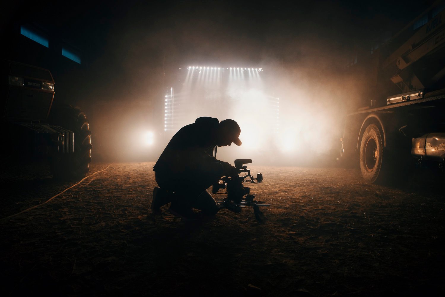man looking into camera with light behind