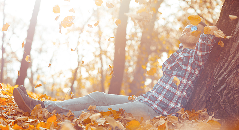 man sitting in leaves