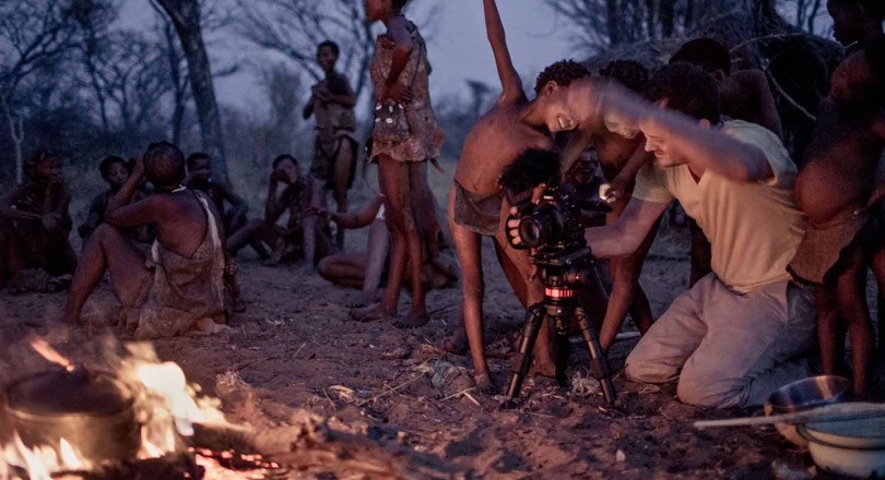 Kids and adult behind a camera
